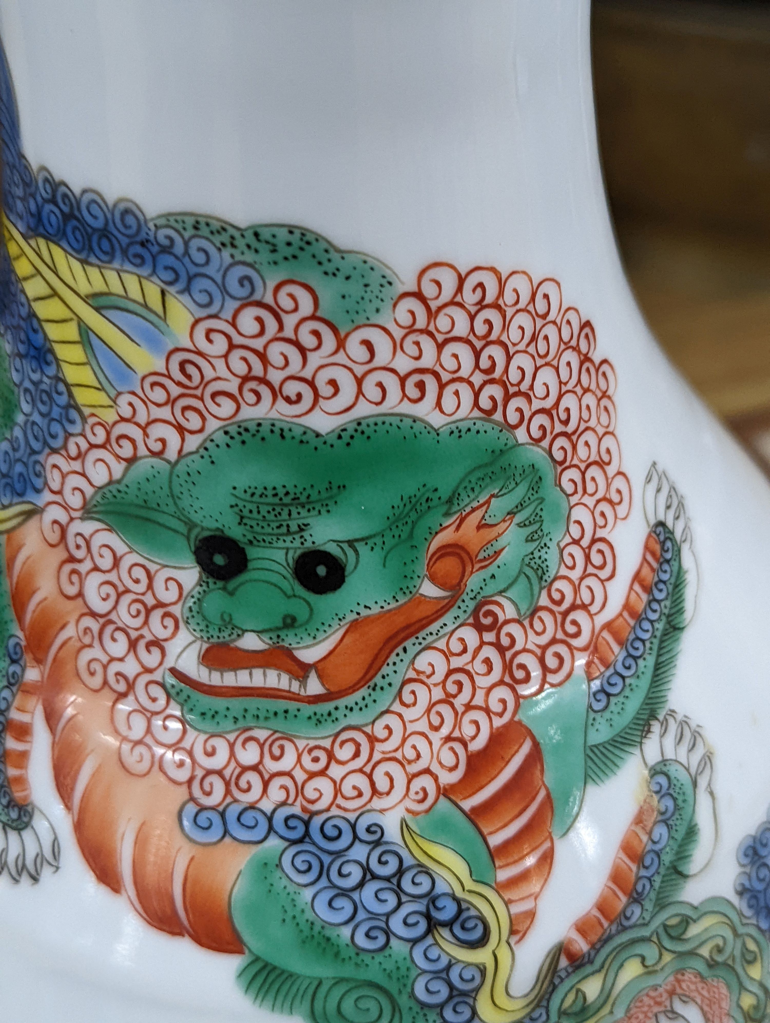 A Chinese famille verte pear-shaped ‘Buddhist lion’ vase, on stand, 32 cms high not including stand